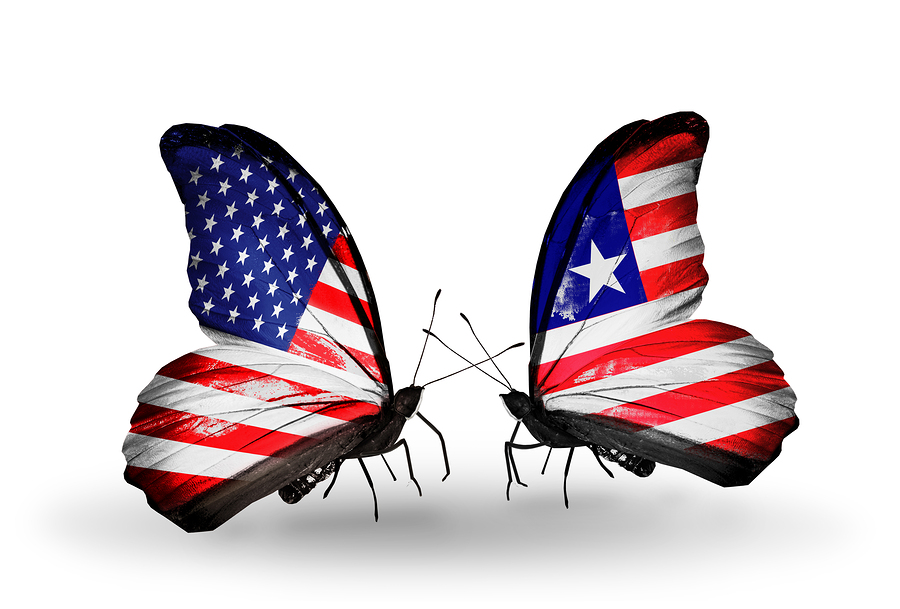 Two butterflies with flags on wings as symbol of relations USA and Liberia